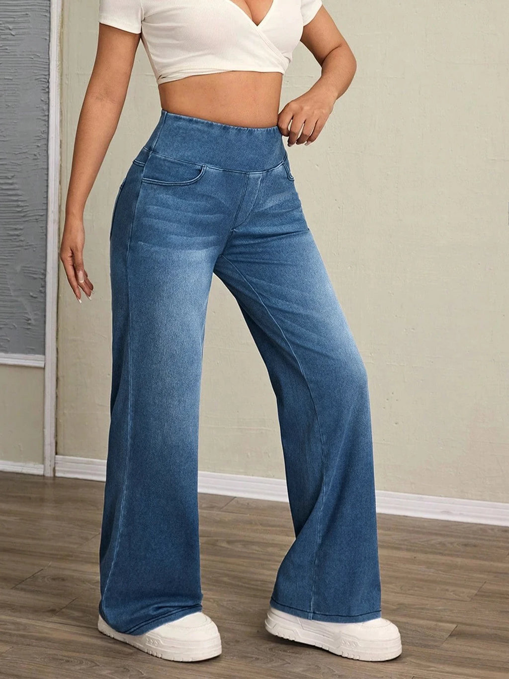 Women's high-rise wide-leg jeans with tummy tuck, slim fit, made from stretch denim fabric, are stylish for casual everyday wear - Azara