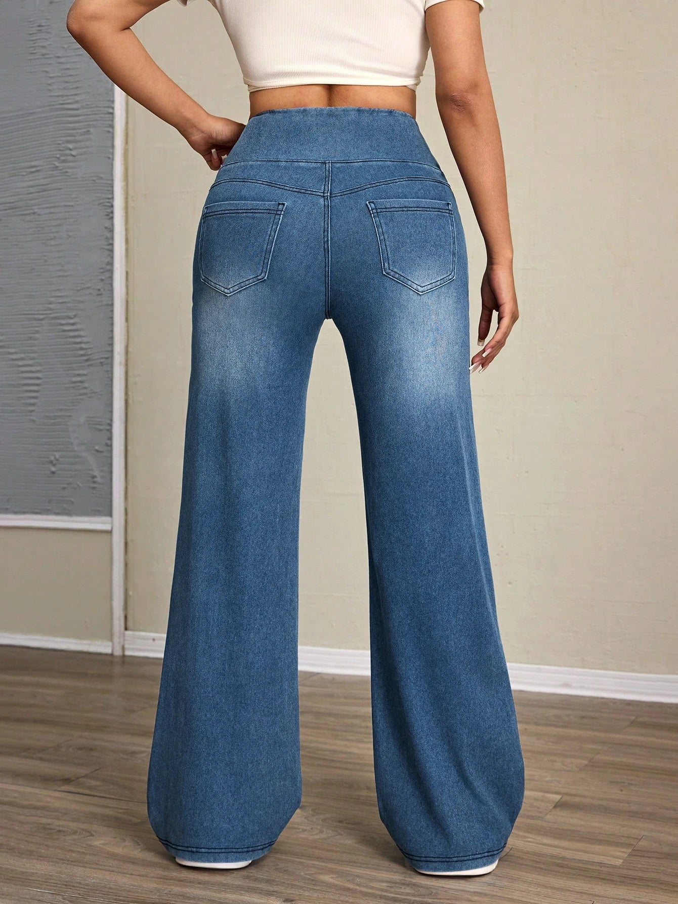 Women's high-rise wide-leg jeans with tummy tuck, slim fit, made from stretch denim fabric, are stylish for casual everyday wear - Azara
