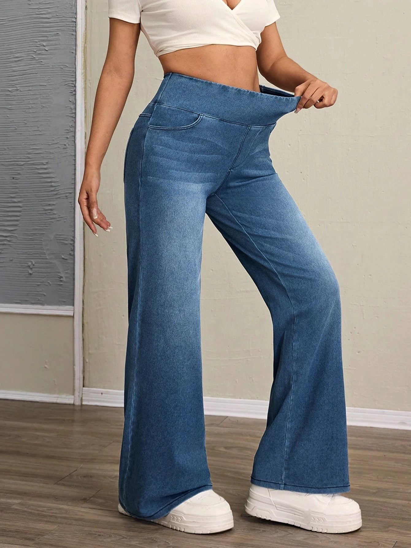 Women's high-rise wide-leg jeans with tummy tuck, slim fit, made from stretch denim fabric, are stylish for casual everyday wear - Azara